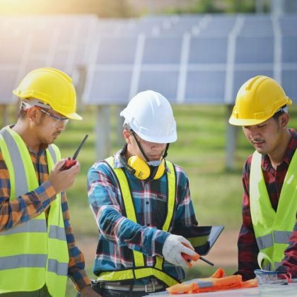 Portrait,Of,Three,Engineers,On,A,Construction,Site,Power,Plant